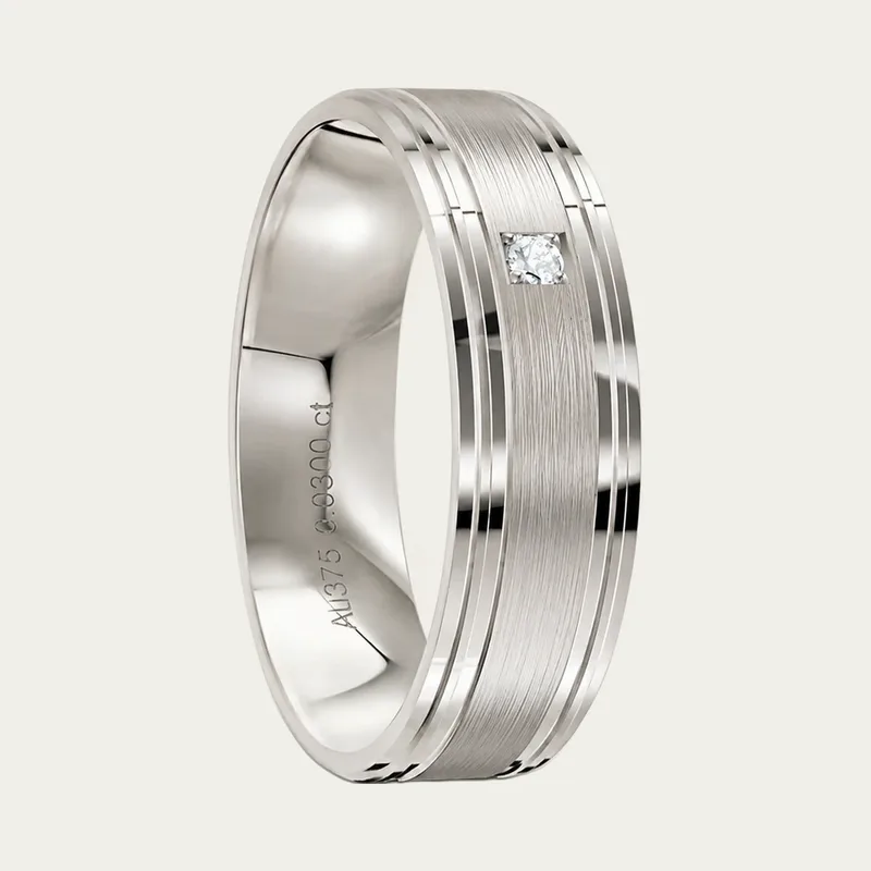 A platinum men's diamond wedding ring with a brushed centre and polished edges